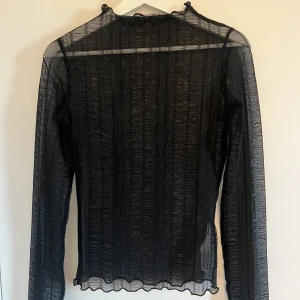 Långarmad  - Genomskinlig långarmad. Super fin. Aldrig använd. 