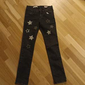 Black jeans for girlwitj shiny stars. 10 years old.