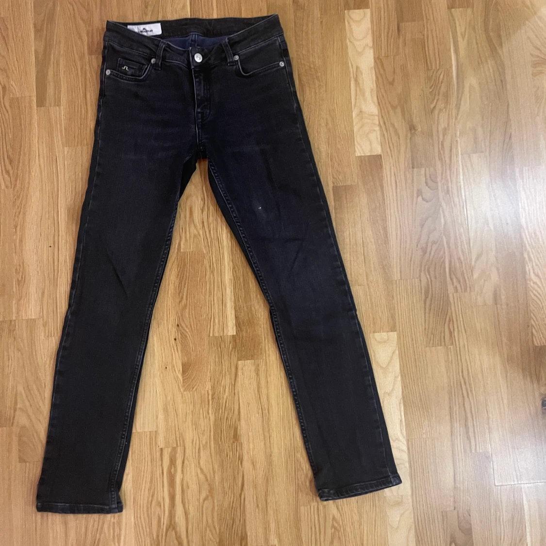 J.Lindberg svarta Jeans 25/30 låg midja