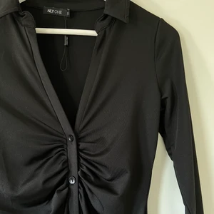 Svart klänning från Nelly  - Svart oanvänd klänning från Nelly i stl S