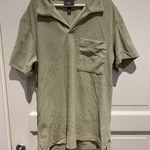 Frotté piké  - ”Grön” frotté piké. Aldrig använd.