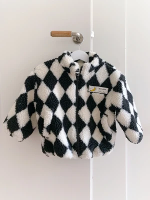 Black and white checked jacket  - Size: 2-3 years old  Material: Polyster  Condition: 90% looking new 