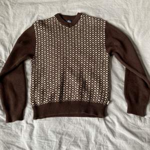 En stussy tröja gjord på ull. Är i ett gott skick och har använts ett fåtal gånger.