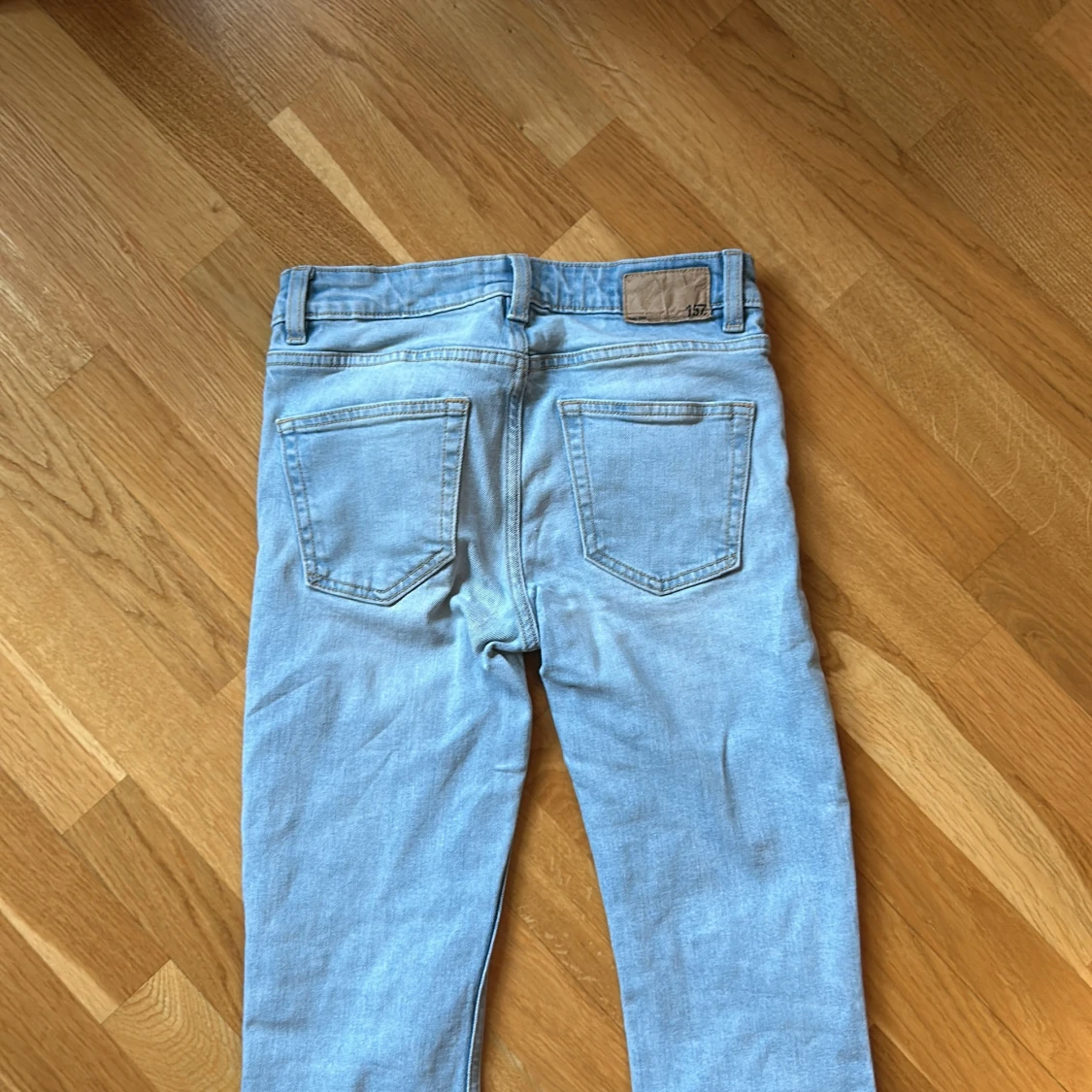 Ljusblå bootcut jeans från 157 - 1