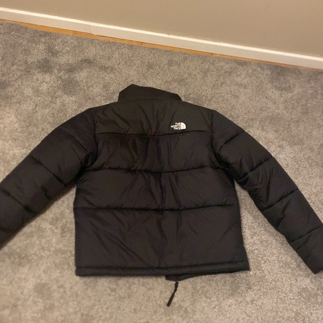 Svart dunjacka från The North Face - 90
