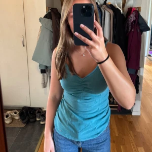 Blått linne  - Säljer det här gulliga blå/gröna linnet. Köparen står för frakten. 