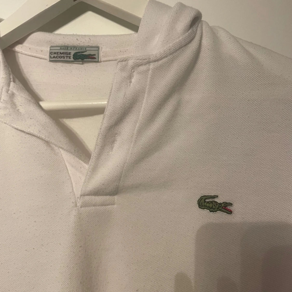 Vit pikétröja från Lacoste - 91