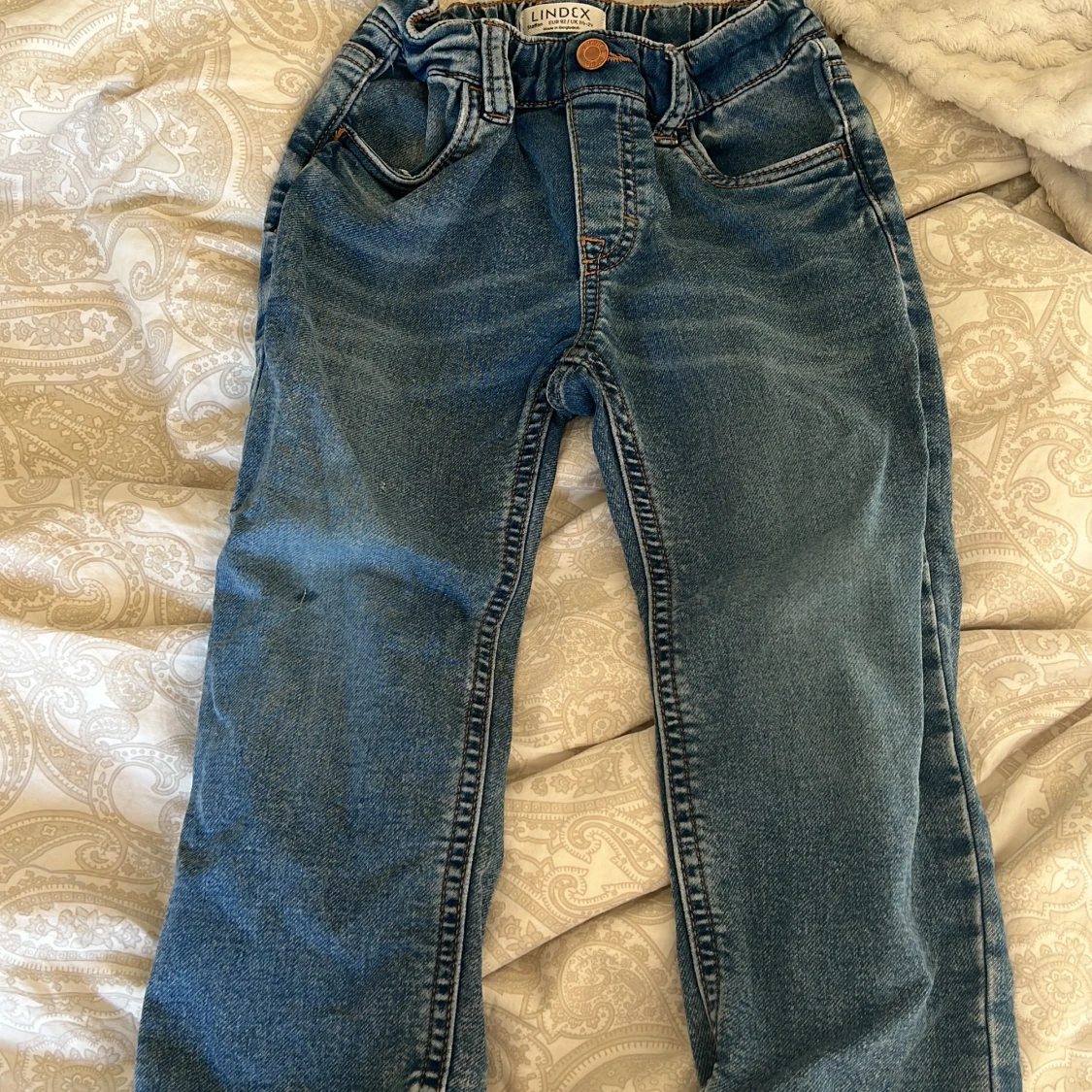 Blå jeansbyxor från Lindex barn