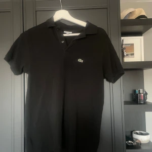 Lacoste piké - En snygg piké från Lacoste i ett mycket bra skick