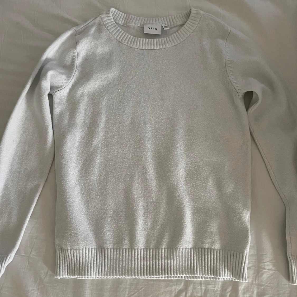 Vit stickad tröja