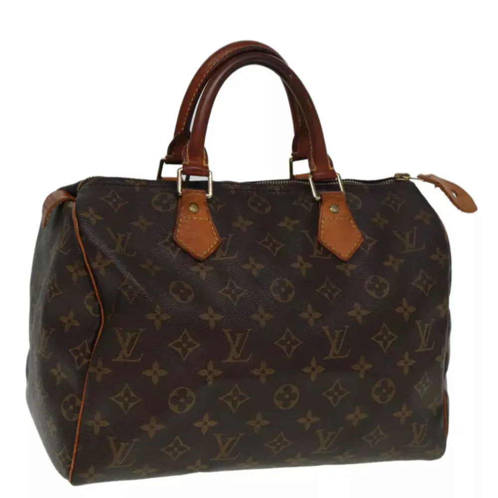 Louis Vuitton Speedy 30. Ett måste i väskkollektionen! Bra storlek för både vardagsbruk och resor. Perfekt att använda som skol-/arbetsväska. Speedy ger en touch av lyx och stil till varje outfit.. Väskor.