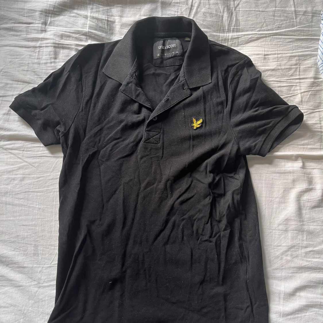 Piké av märket lyle & scott.