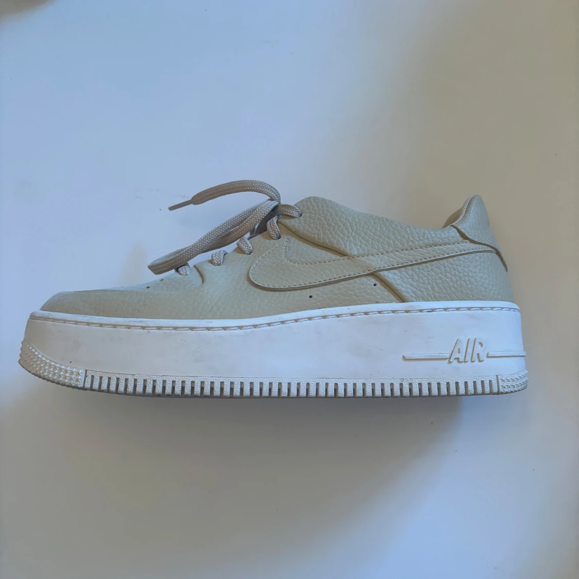 Beige Nike Air Force sneakers