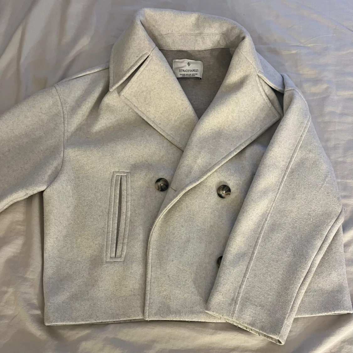 Beige kappa från strandivarius