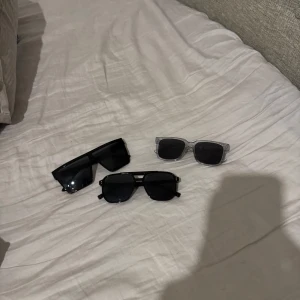 Tre par solglasögon i olika stilar - Säljer tre par solglasögon som inte används för 30kr för alla