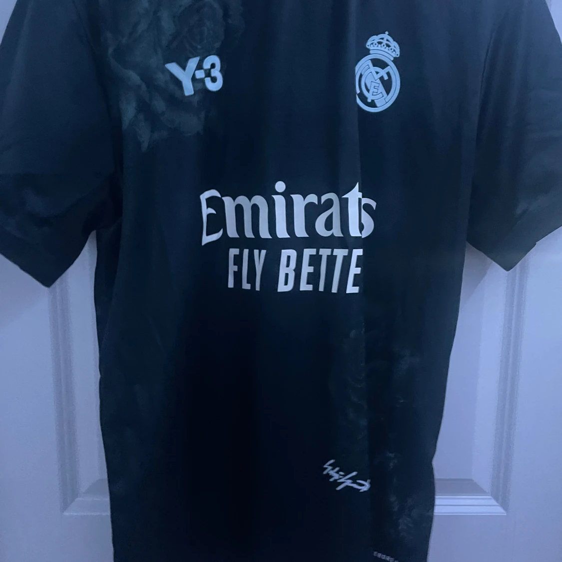 Svart Real Madrid fotbollströja