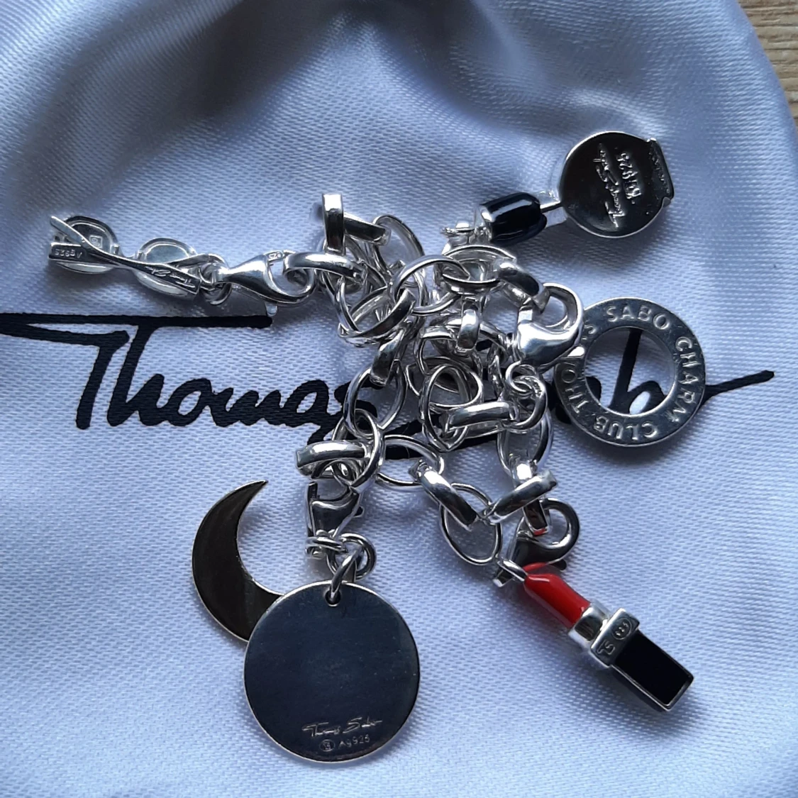 THOMAS SABO ARMBAND M BERLOCKER.  - 93