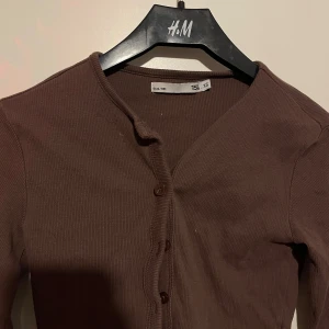 Brun Kofta  - sparsamt använd 