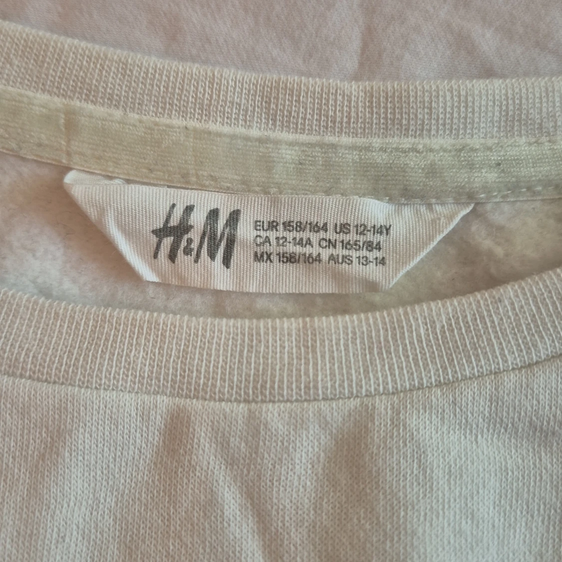 Vit tröja med paljetter från H&M - 90