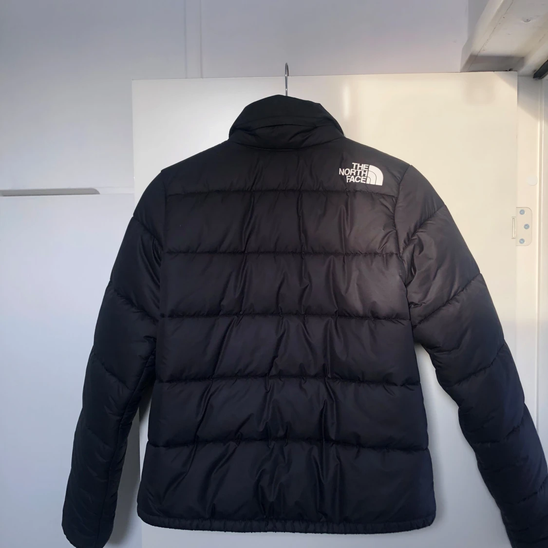 Svart dunjacka från The North Face - 90