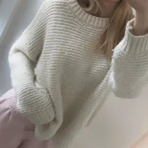 Knitted white sweater