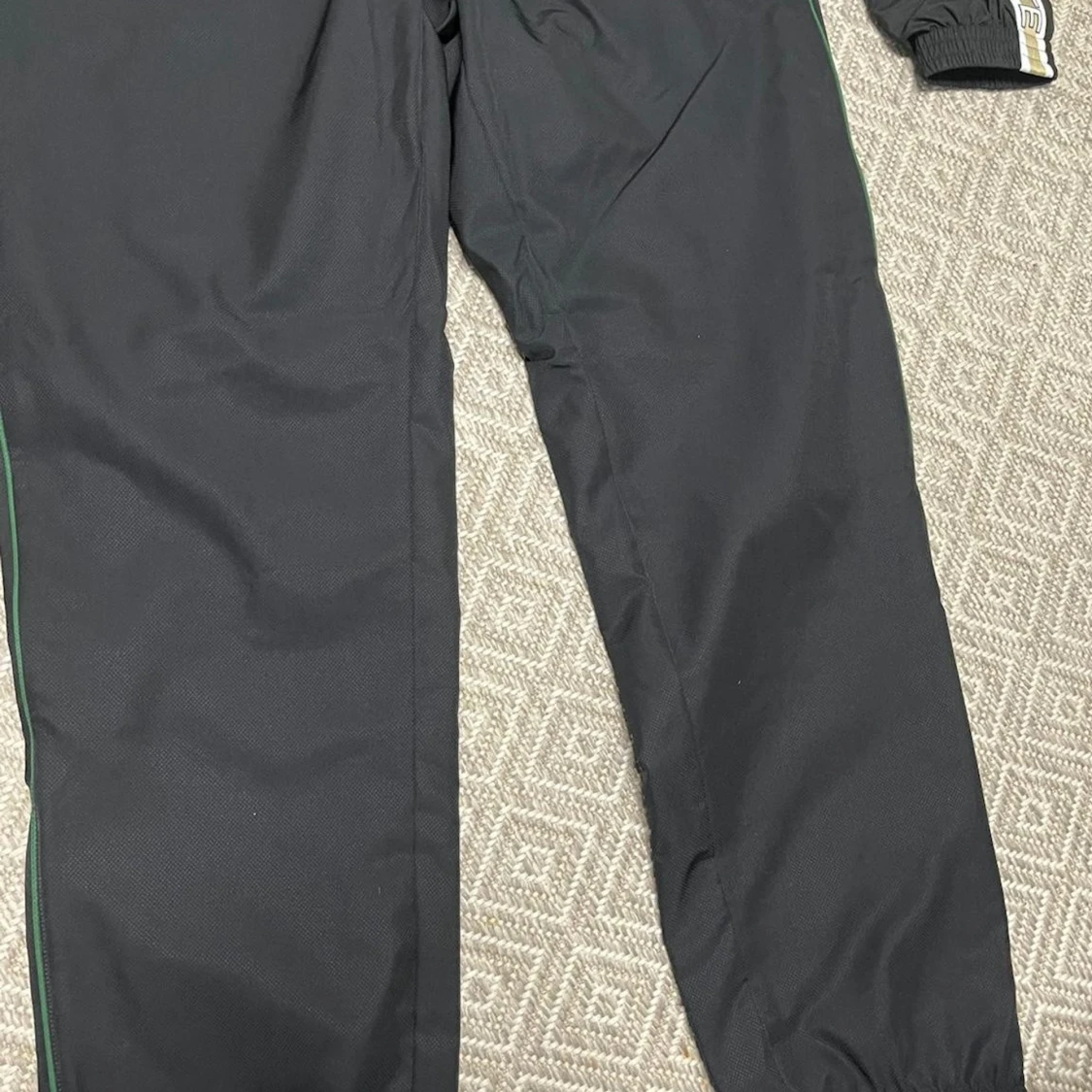 Svart tracksuit från Lacoste - 1