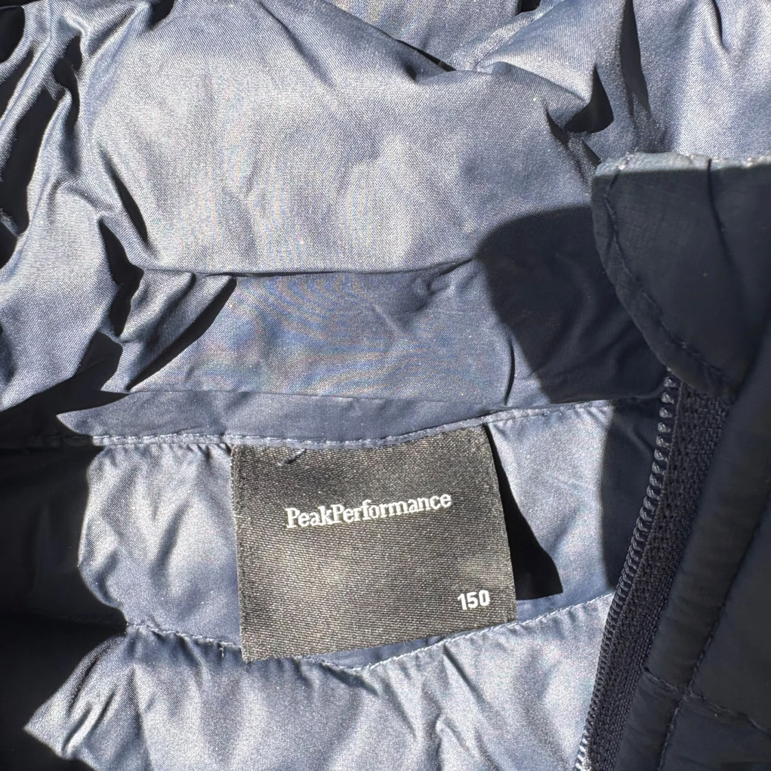 Mörkblå dunjacka Peak Performance 150 - 1