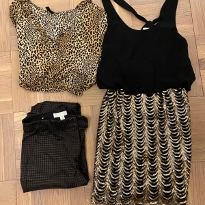 Superfint klädpaket i stl. 36! Nyskick!  - Klädpaket i stl. 34-36! Innehåll: Trendig leopardmönstrad omlottblus med långa ärmar och volangdetaljer. Bruna, rutiga kostymbyxor. Läcker svart/guldig klänning! 