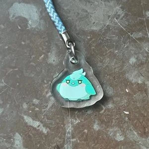 Genshin impact Xiaobird phonecharm - Phonecharm of Xiao as a bird from Genshin impact! Perfect for your phone decorations or collection :)  (There might be scratches on the surface but that’s only on the protective layer of plastic, peel it off on both sides and it’ll be perfectly shiny!)