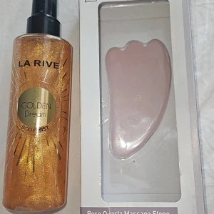Golden mist och rose quastz stone  - La Rive Golden Dream Body Mist med guldskimmer ger huden en glittrig finish och fräsch doft. Flaskan är transparent med svart spraymunstycke och innehåller gyllene glitter. Perfekt för dig som vill ha extra glow till kroppen. Och en kropps sten för öka blodcirkulationen och för lite extra massage. Går att köpa st