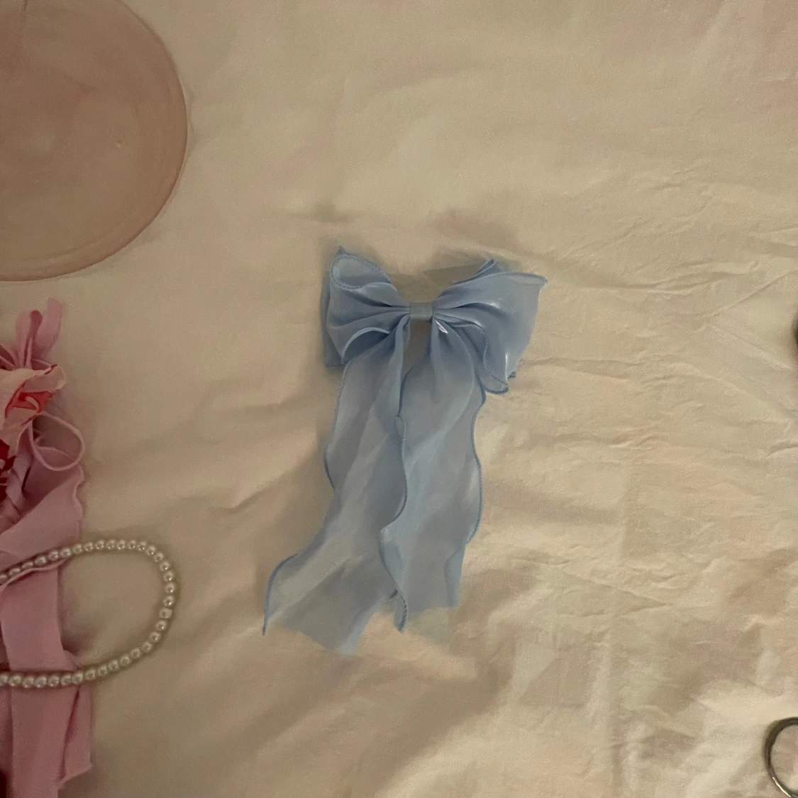 Ljusblå rosett hårklämma