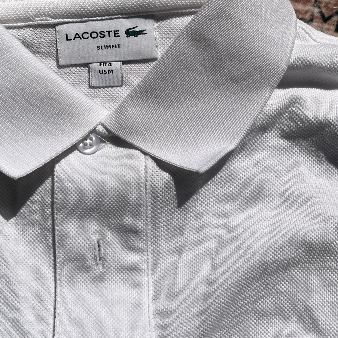 Vit pikétröja från Lacoste - 1