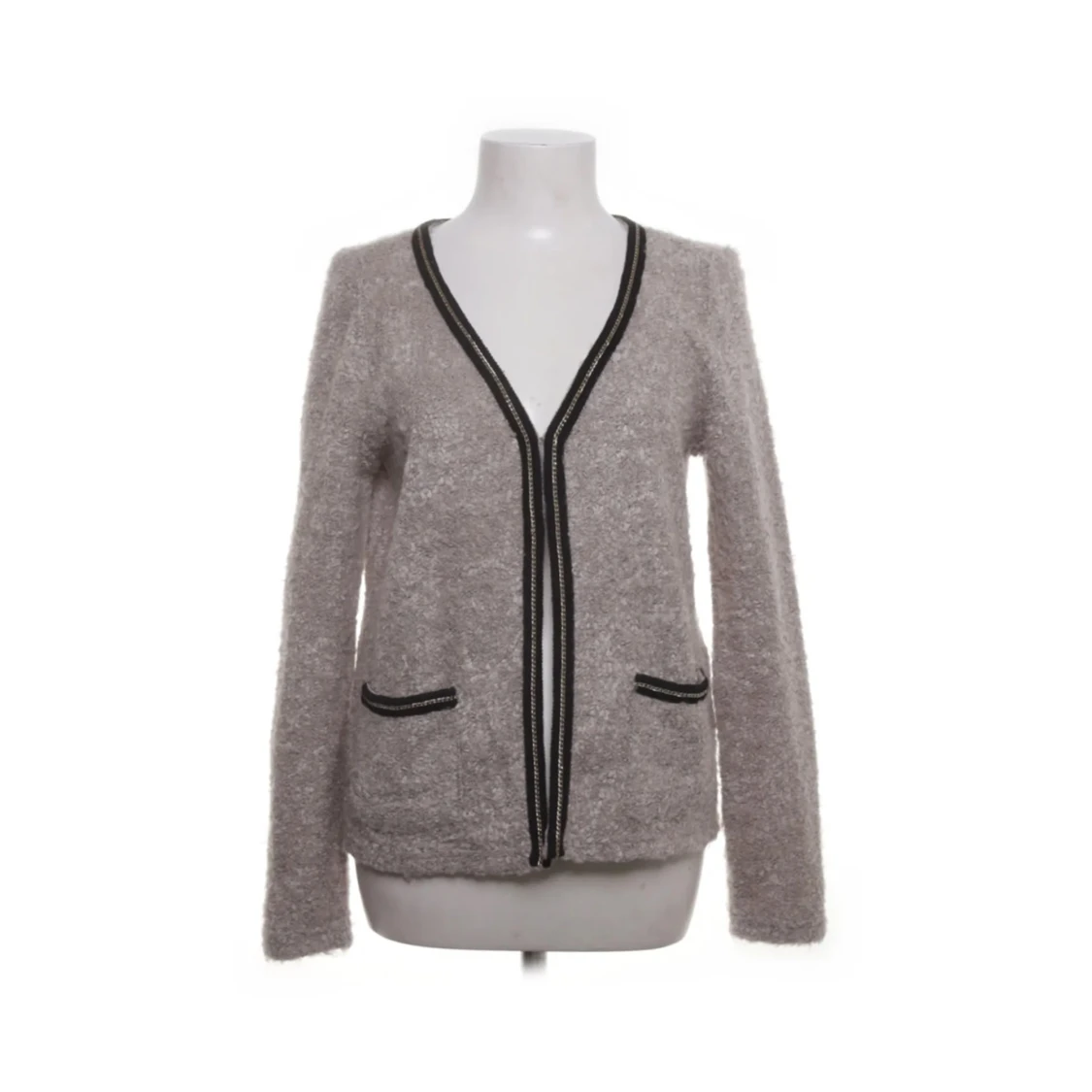 Beige kofta med svarta detaljer