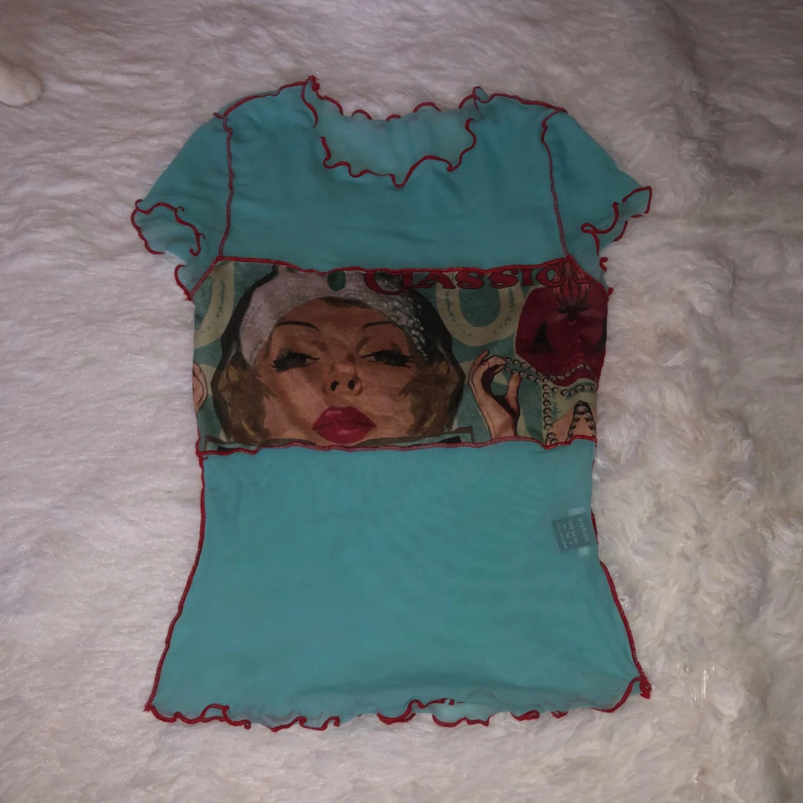 Turkos topp med konstmotiv