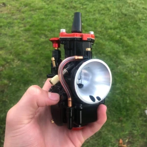 Förgasare 24mm PWK - Förgasare 24mm pwk. Testkörd en gång och funkar utmärkt. Extra munstycken och nål följer med.