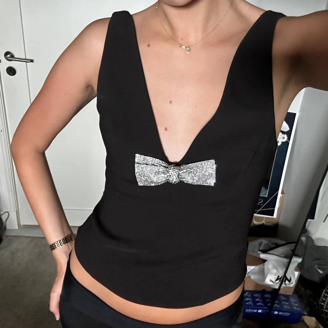 Svart korsett med rosett