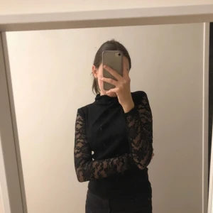 black long sleeve with lace - perfect for halloween  only worn about 3 times 
