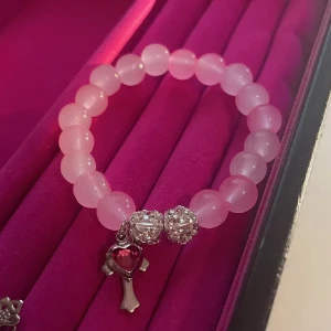 Svart och rosa armband - .