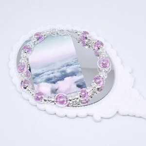 Pink eye armband  - Rosa- lila akrylpärlor med silvriga detaljer. Armbandet är cirka 16cm och är justerbart. Andra storlekar kan självklart önskas. 