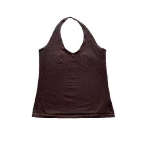 Halterneck linne - Brunt linne i halterneckmodell. Har gulgrönfärgade sömmar vilket ger en häftig detalj. Stretchig och passar S-M, kan även passa XS. Hör av dig om du är intresserad, vill få mått eller har andra frågor<3