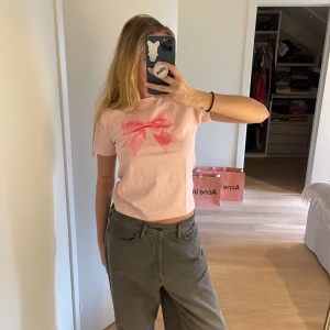 Bow T-shirt - Never worn!! Recieved just a day ago in the post that’s why it has clear folds on it. From famous: In Print We Trust :))