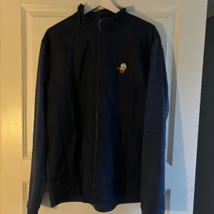 Kalle Anka golf tröja - Unik Kalle Anka golftröja.