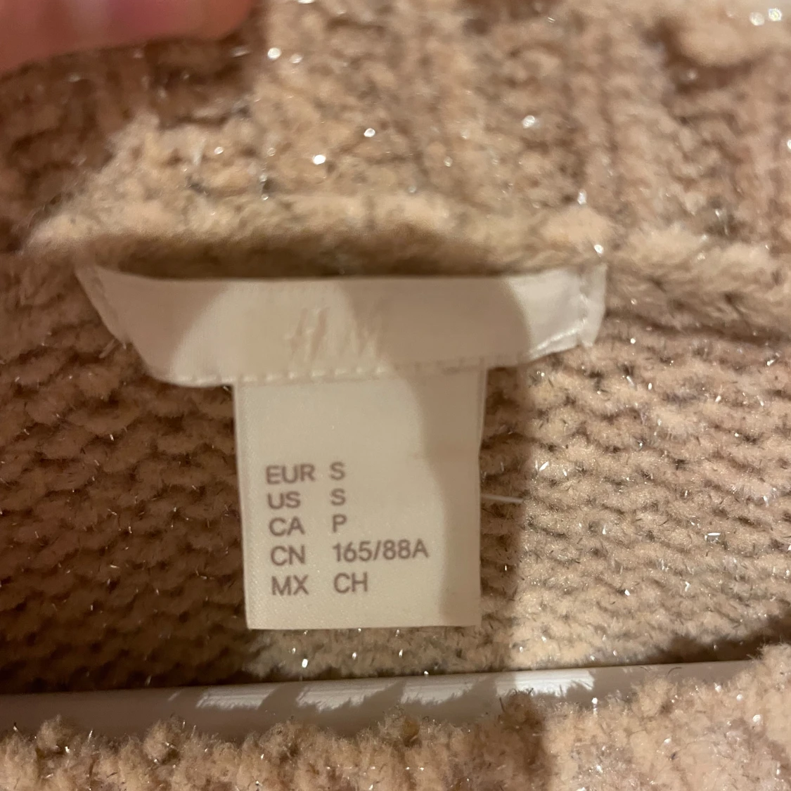 Stickad tröja med glitter  - 91