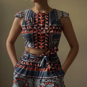 Vintage Wax Print Crop Top - Beautiful wax print set in navy and orange colors. Handcrafted Top features a unique cap sleeve and crop boxy silhouette. Back Zip Closure. Matching Pants Sold Separately  100% Cotton  Best Fits Size XS