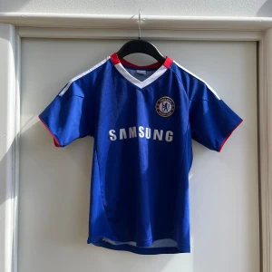 Chelsea F.C. Matchtröja - | Chelsea F.C. | Matchtröja | Utan något tryck | Storlek: XS |