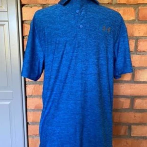 Piké från Under Armour strl S/M - Funktions material  Nyskick  