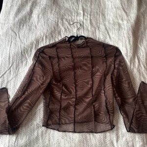 Topp - Långärmad mesh topp