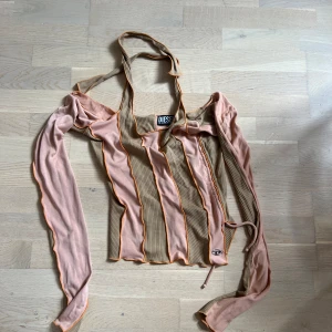 Långärmad tröja Diesel  - Använd en gång. Båtringade axlar med halterneck. Strl: S