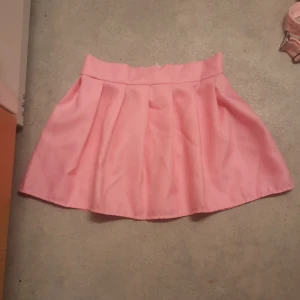 Rosa schoolgirl kjol - Storlek; XS