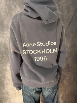 Acne stufios hoodie (navy/m) - Great condition, used once. Same day shipping.  Comes with the original bag that it came with. Relaxed/ baggy fit. 100% cotton.